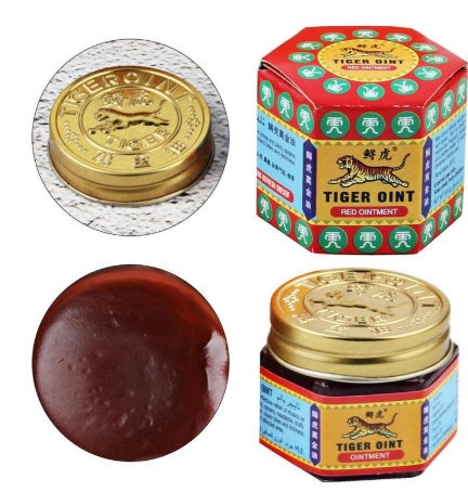 Tiger Balm ointment packaging and product on a white background
