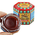 Red jar of Tiger Balm ointment with its packaging on a white background