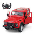 Red Land Rover model car with open doors and a steering wheel on a white background